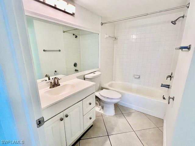 full bath featuring toilet, vanity, shower / washtub combination, and tile patterned floors