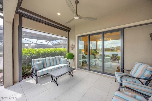 view of patio / terrace featuring glass enclosure and ceiling fan