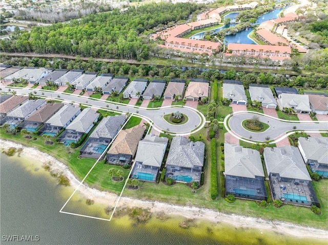 bird's eye view with a water view and a residential view