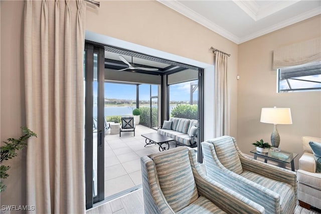 interior space with a sunroom, a water view, crown molding, and light tile patterned floors