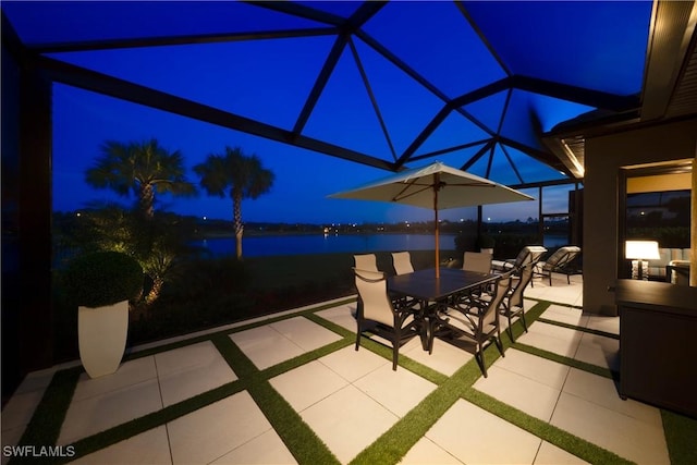 view of patio featuring a lanai and outdoor dining space