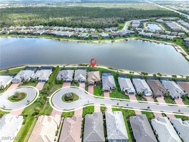 birds eye view of property featuring a water view and a residential view