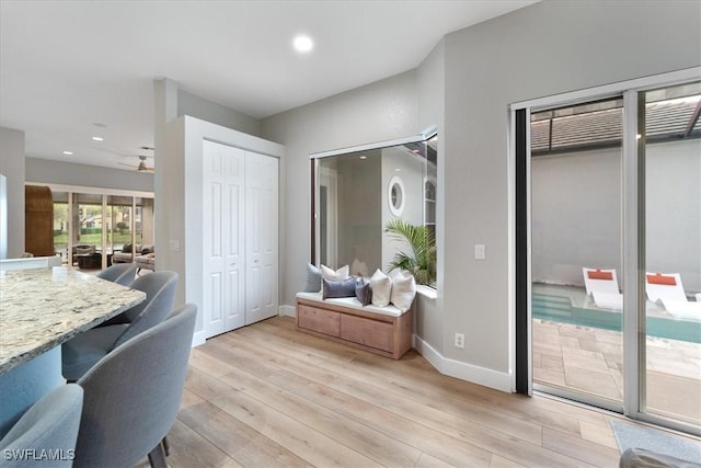 interior space with light wood-style flooring, baseboards, ceiling fan, and recessed lighting