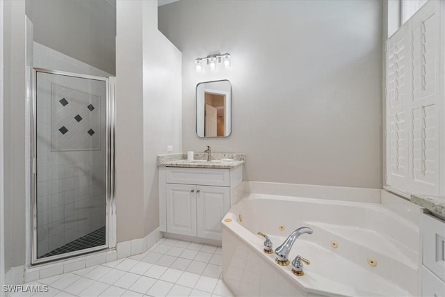 full bath featuring a jetted tub, a shower stall, tile patterned flooring, and vanity