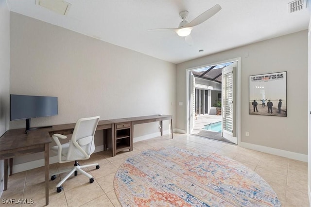 office featuring baseboards, ceiling fan, visible vents, and tile patterned floors