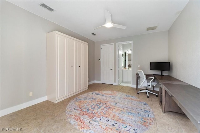 home office with visible vents, ceiling fan, baseboards, and light tile patterned flooring