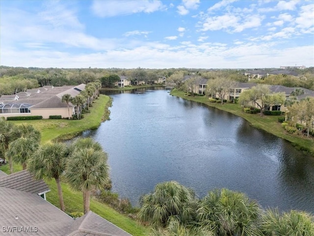 birds eye view of property with a water view