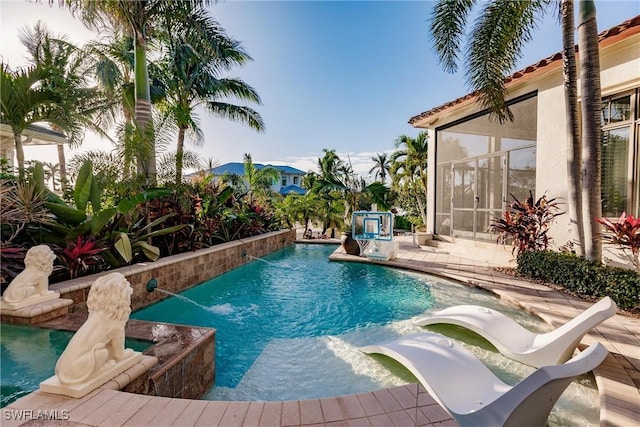 view of pool with a pool with connected hot tub and a patio