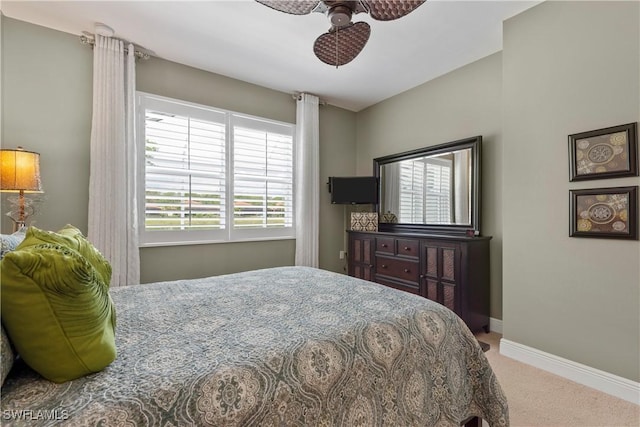 bedroom with carpet and baseboards