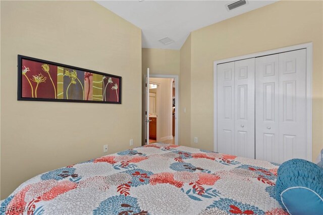 bedroom featuring visible vents and a closet