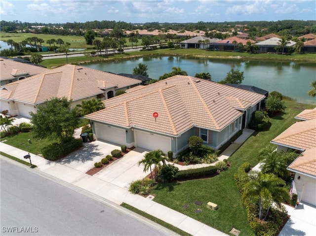 aerial view featuring a water view and a residential view