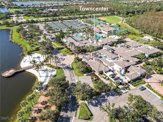 drone / aerial view with a water view and a residential view