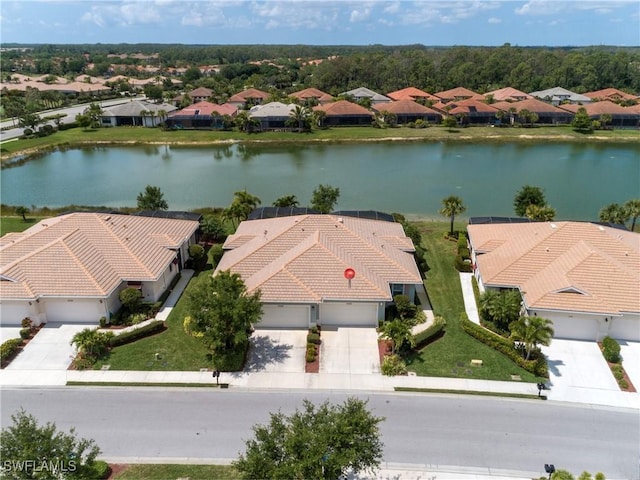 aerial view with a residential view and a water view