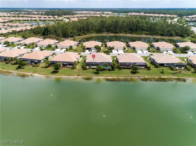 birds eye view of property featuring a water view and a residential view