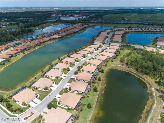 bird's eye view featuring a water view and a residential view