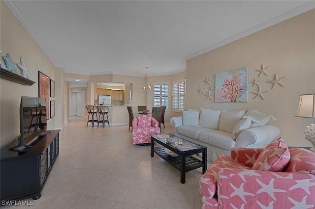 living area featuring crown molding and a notable chandelier