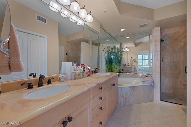 bathroom with a bath, a shower stall, visible vents, and a sink