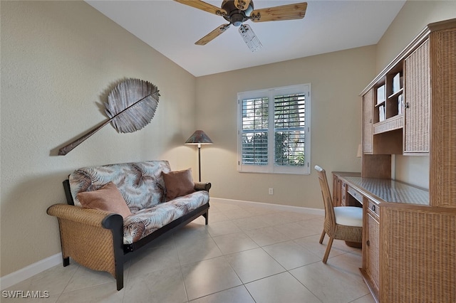 office space with ceiling fan, light tile patterned flooring, and baseboards