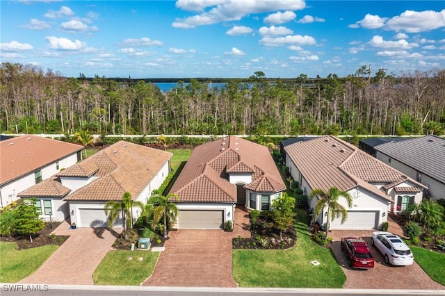 bird's eye view featuring a residential view and a view of trees