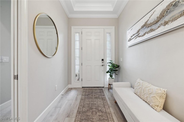 entrance foyer with crown molding, baseboards, and wood finished floors