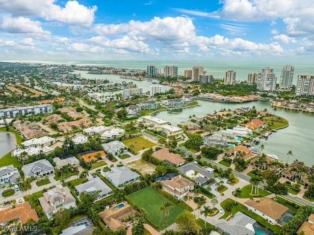 drone / aerial view featuring a water view and a city view