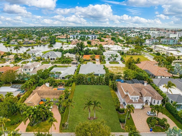 aerial view with a water view and a residential view