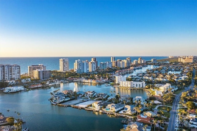 birds eye view of property featuring a water view and a view of city