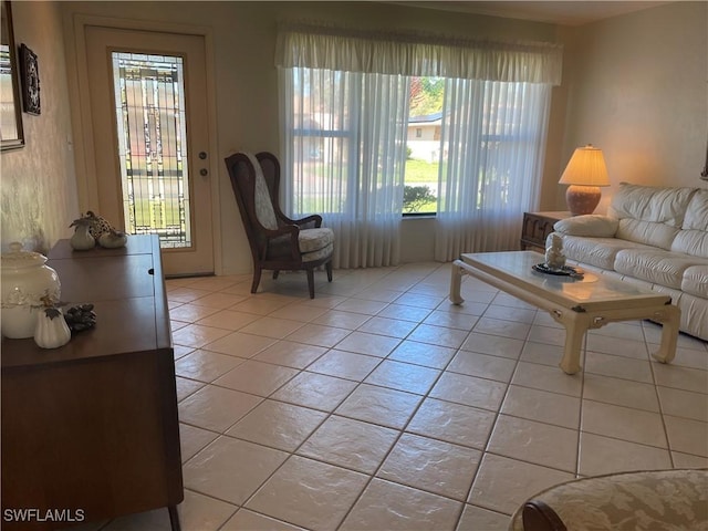 living area featuring plenty of natural light and light tile patterned floors