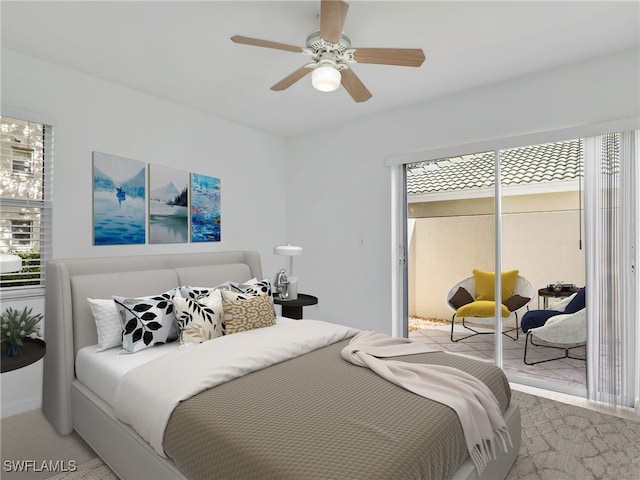 carpeted bedroom featuring access to exterior and a ceiling fan