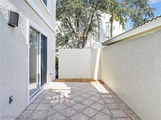 view of patio featuring fence