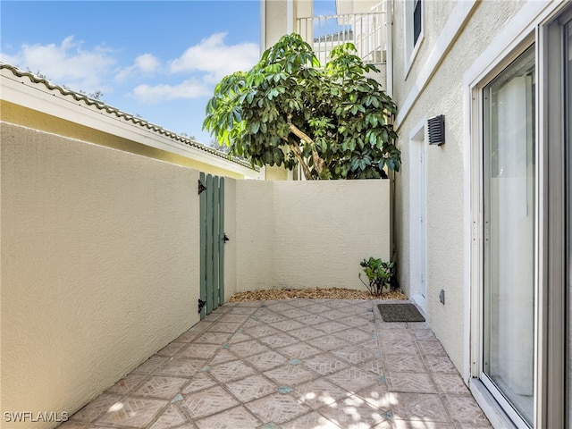 view of patio with a gate and fence