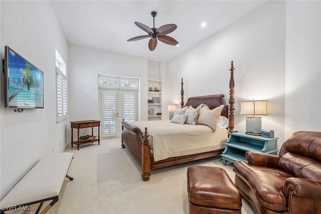 bedroom with a ceiling fan, light colored carpet, access to outside, french doors, and recessed lighting