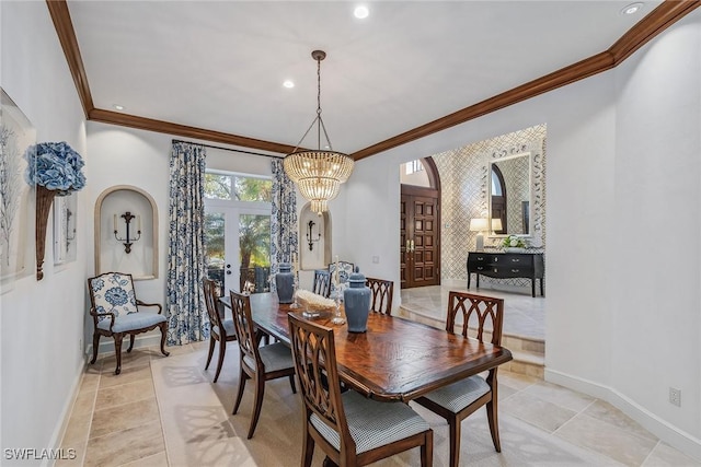 dining room featuring light tile patterned floors, a notable chandelier, baseboards, french doors, and ornamental molding