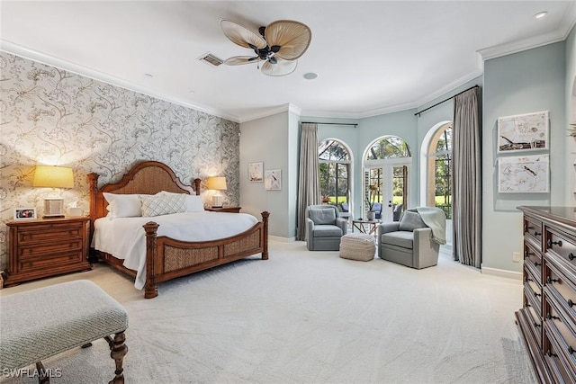 carpeted bedroom with wallpapered walls, baseboards, an accent wall, access to outside, and crown molding