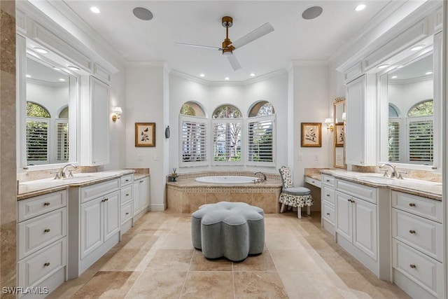 bathroom featuring a sink, two vanities, and crown molding