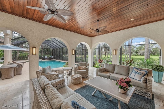 exterior space featuring wooden ceiling and a ceiling fan