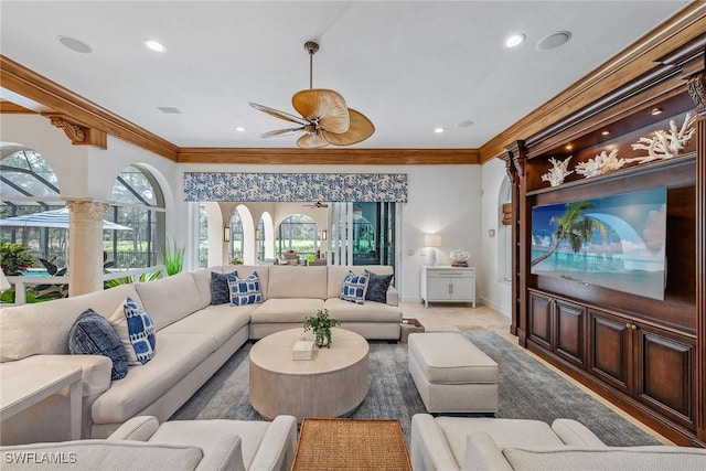 living room featuring ceiling fan, ornamental molding, baseboards, and recessed lighting