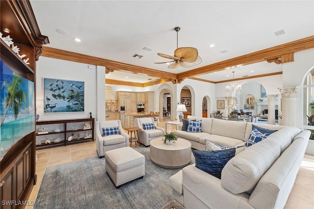 living room with arched walkways, light tile patterned flooring, visible vents, and crown molding