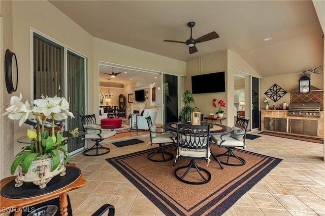 view of patio featuring ceiling fan, outdoor dining area, and area for grilling