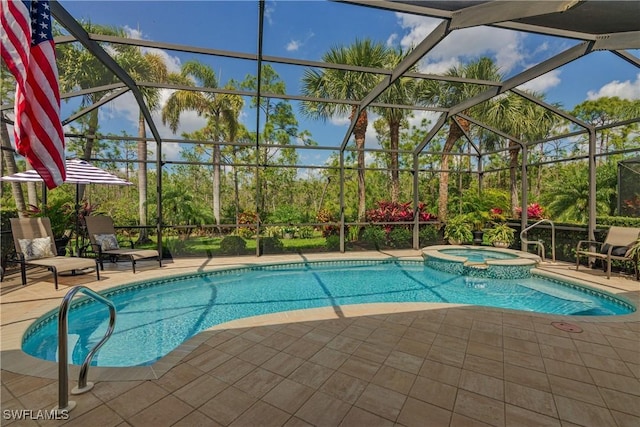 view of pool featuring a lanai, a pool with connected hot tub, and a patio