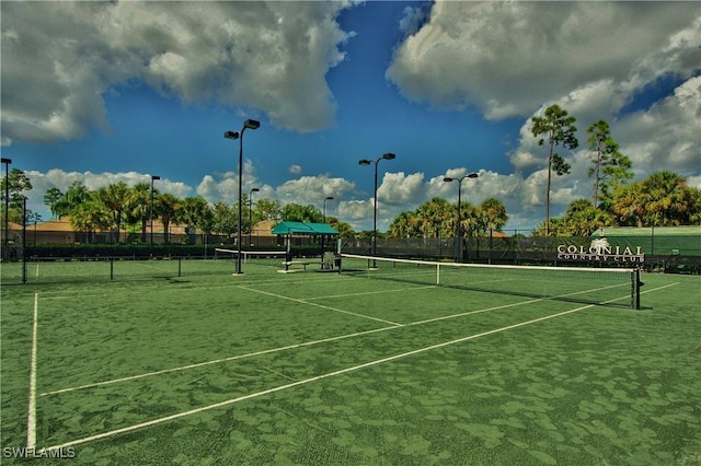 view of sport court with fence