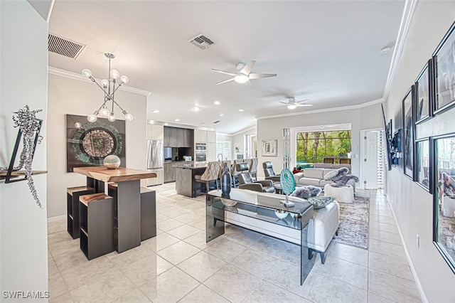 living room with light tile patterned flooring, visible vents, and crown molding