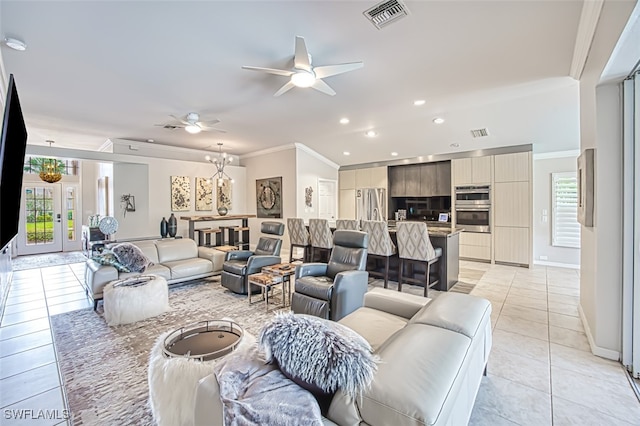 living room featuring ornamental molding, visible vents, and light tile patterned floors