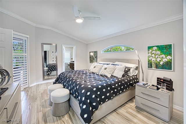 bedroom with ornamental molding, multiple windows, vaulted ceiling, and wood finished floors