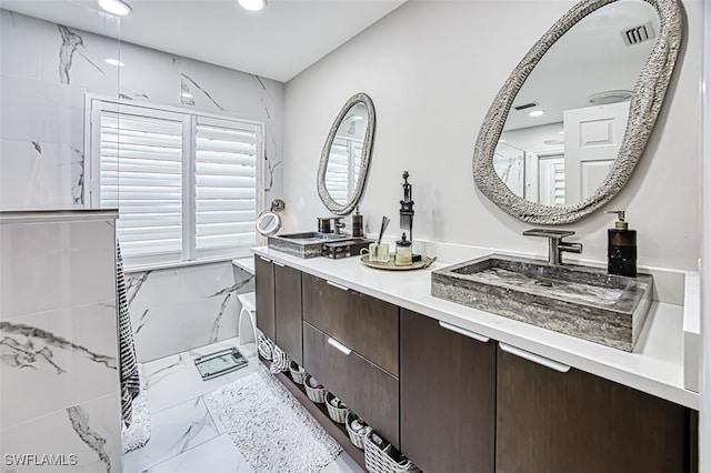 full bathroom featuring recessed lighting, a sink, visible vents, marble finish floor, and double vanity