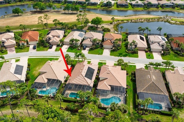 aerial view featuring a residential view and a water view