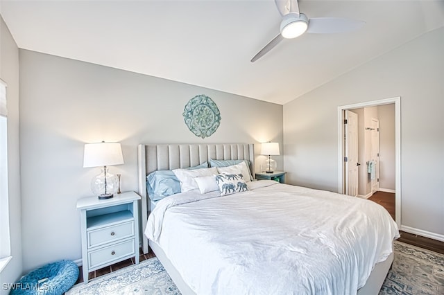 bedroom featuring a ceiling fan, baseboards, vaulted ceiling, and dark wood-style flooring