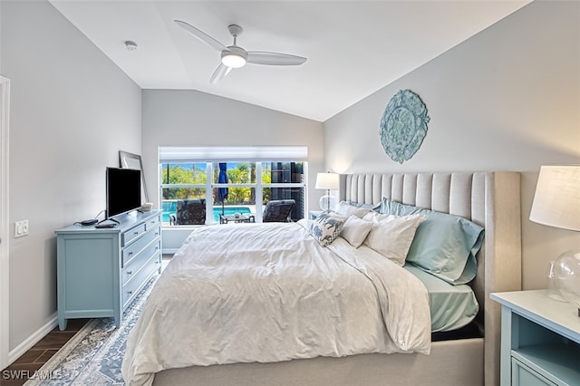 bedroom with lofted ceiling, ceiling fan, baseboards, and wood finished floors