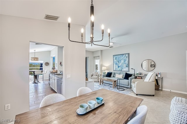 dining area with a chandelier, visible vents, baseboards, and light tile patterned floors