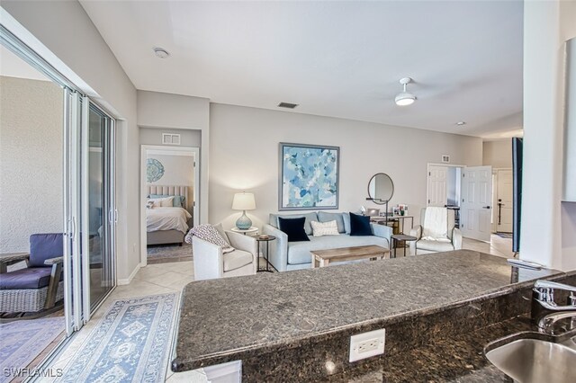 living room with visible vents and light tile patterned floors